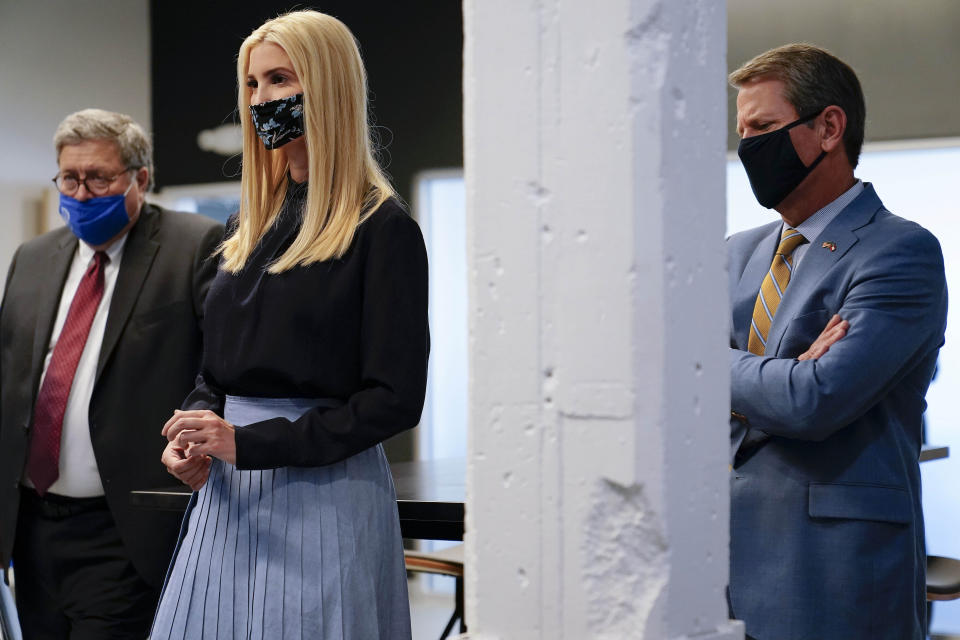 U.S. Attorney General William Barr, left, and Ivanka Trump, center and Georgia Gov. Brian Kemp listen during a tour at the Georgia Center for Child Advocacy on Monday, Sept. 21, 2020, in Atlanta. (AP Photo/Brynn Anderson)