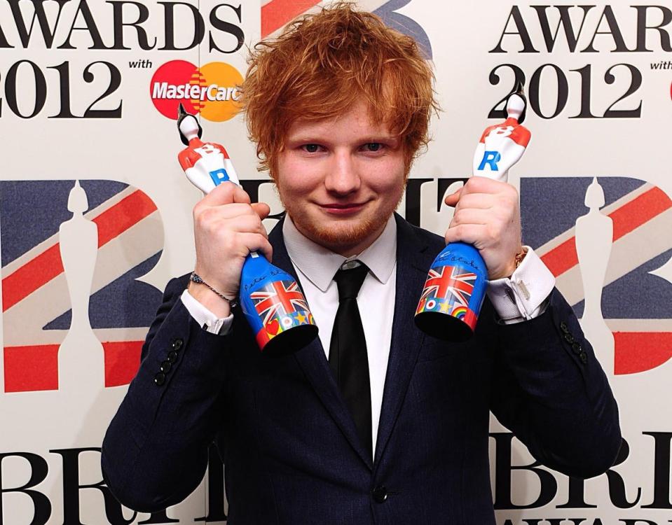 Ed Sheeran with his British Breakthrough Act award and Best Male Solo Artist award in the press room at the 2012 Brit Awards at The O2 Arena, London (PA )