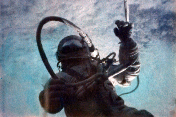 First spacewalker Alexei Leonov of the former Soviet Union was attached to his Voskhod 2 spacecraft by an 18-foot-long umbilical cable.