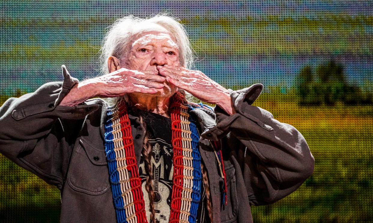 Willie Nelson pauses while leaving the stage after his performance to gaze upon the sold out crowd and blow them kisses at Farm Aid 2023 on Saturday, Sept. 23, 2023, at Ruoff Music Center in Noblesville, Ind. Nelson, 91, will play the BMO Pavilion in Milwaukee on May 18.