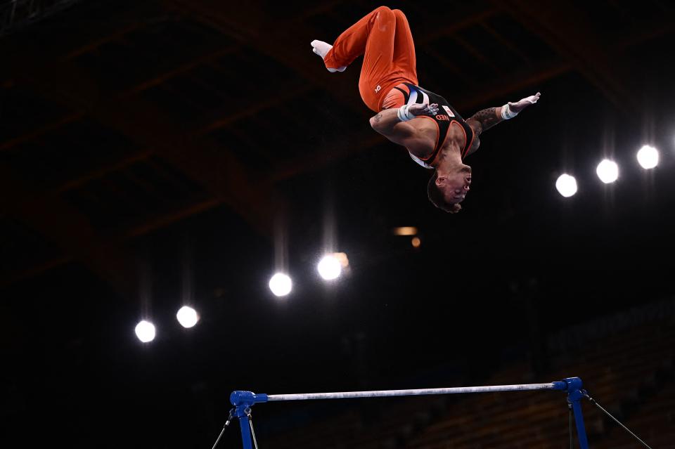 <p>Netherlands' Bart Deurloo competes in the artistic gymnastics men's horizontal bar final of the Tokyo 2020 Olympic Games at Ariake Gymnastics Centre in Tokyo on August 3, 2021. (Photo by Jeff PACHOUD / AFP) (Photo by JEFF PACHOUD/AFP via Getty Images)</p> 