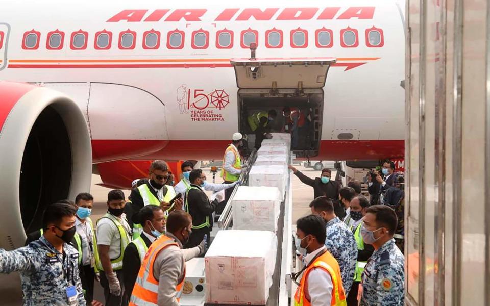 Boxes of COVID-19 vaccines arriving in Dhaka, Bangladesh - High Commission of India Dhaka/AP