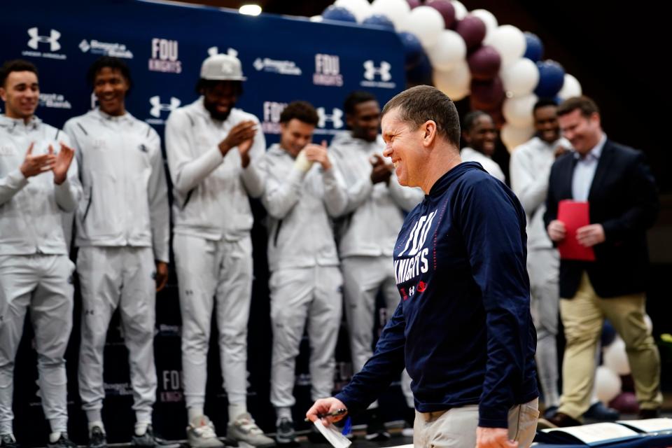 Fairleigh Dickinson University men's basketball head coach Tobin Anderson smiles as the team applauds him during a celebration for the historic 2022-23 seasons of the Knights' men's and women's basketball teams in Hackensack on March 27, 2023.
