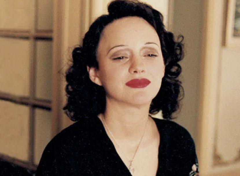 Marion Cotillard as Édith Piaf, smiling