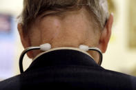 In this Tuesday, Oct. 30, 2012 photo, a doctor who started practicing medicine in 1955 wears a stethoscope around his neck as he tends to patients in his office in Illinois. Two centuries after its invention, the stethoscope _ the very symbol of the medical profession _ is facing an uncertain prognosis. It is threatened by hand-held devices that are also pressed against the chest but rely on ultrasound technology, artificial intelligence and smartphone apps instead of doctors’ ears to help detect leaks, murmurs, abnormal rhythms and other problems in the heart, lungs and elsewhere. (AP Photo/Jeff Roberson)