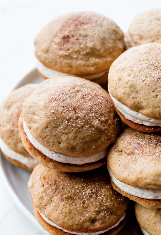 <p>Sally's Baking Addiction</p><p>These apple spice whoopie pies combine apple cider, applesauce, and cinnamon with creamy spiced buttercream to make an irresistible cookie cake sandwich. </p><p><strong>Get the recipe: <em><a href="https://sallysbakingaddiction.com/apple-spice-whoopie-pies/" rel="nofollow noopener" target="_blank" data-ylk="slk:Apple Cinnamon Spice Whoopie Pies;elm:context_link;itc:0;sec:content-canvas" class="link ">Apple Cinnamon Spice Whoopie Pies</a></em></strong></p>
