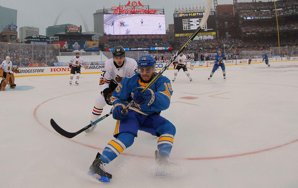 <p>ST. LOUIS, MO – JANUARY 2: Robby Fabbri #15 of the St. Louis Blues and Trevor van Riemsdyk #57 of the Chicago Blackhawks chase the puck during the 2017 Bridgestone NHL Winter Classic at Busch Stadium on January 2, 2017 in St. Louis, Missouri. (Photo by Dilip Vishwanat/Getty Images) </p>