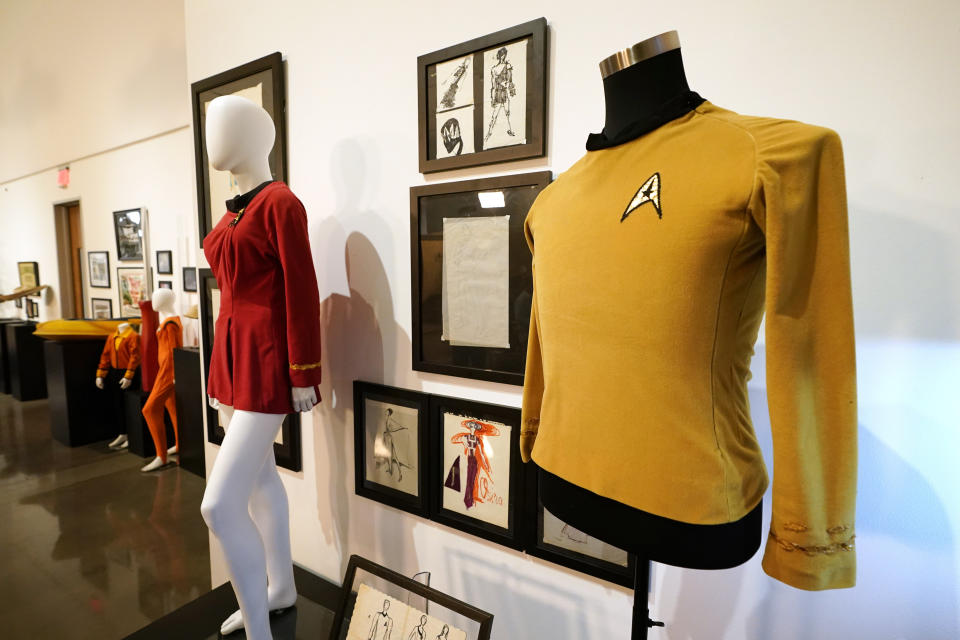 Costumes used on the television show "Star Trek" are displayed on mannequins, Thursday, April 27, 2023, in Irving, Texas. A dizzying number of props, sets, and costumes from television shows beloved by generations of viewers will be sold at auction next month. The collection James Comisar has spent over 30 years amassing includes "The Tonight Show" set Johnny Carson gave him after retiring, the timeworn living room from "All in the Family," and the bar where Sam Malone served customers on Cheers. (AP Photo/Tony Gutierrez)