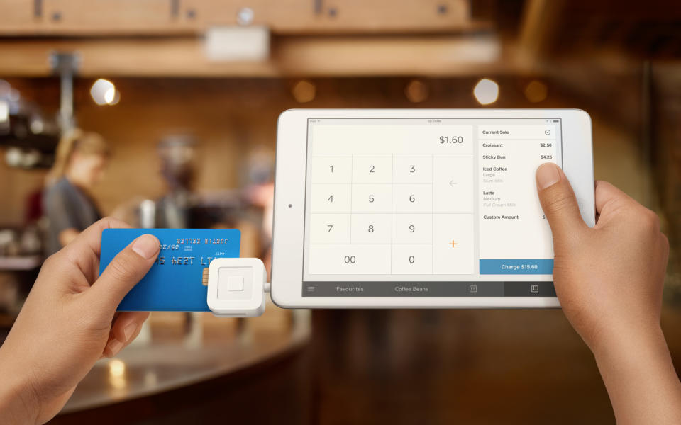A tablet using Square's dongle to accept a card payment.