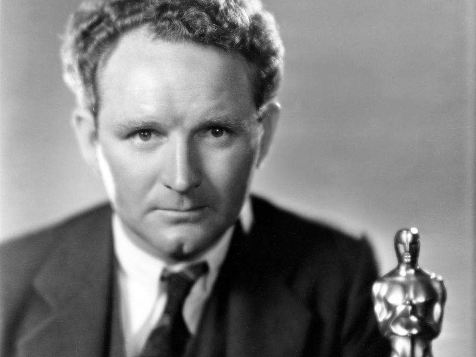 Frank Borzage poses with his Oscar.