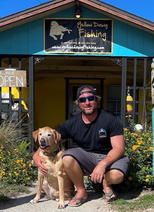 Jamie Thrappas with his yellow lap outside his Yellow Dawg bat shop.