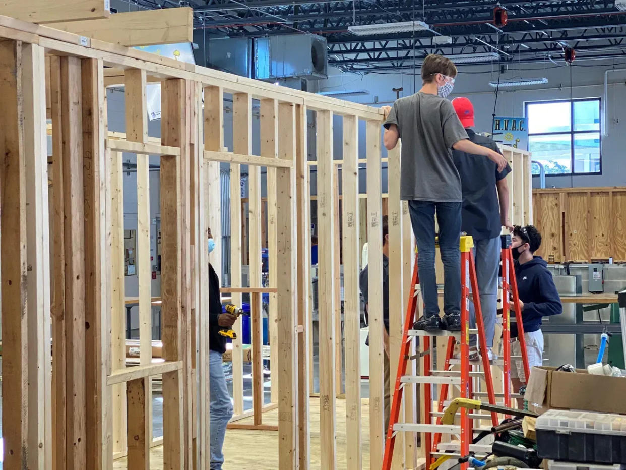 Students work on a tiny home at Suncoast Technical College, a two-year project with students from CareerEdge.