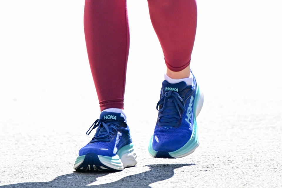 Close up of Olivia Wilde's Hoka sneakers. running shoes, Hoka shoes, Bondi 8, athleisure footwear