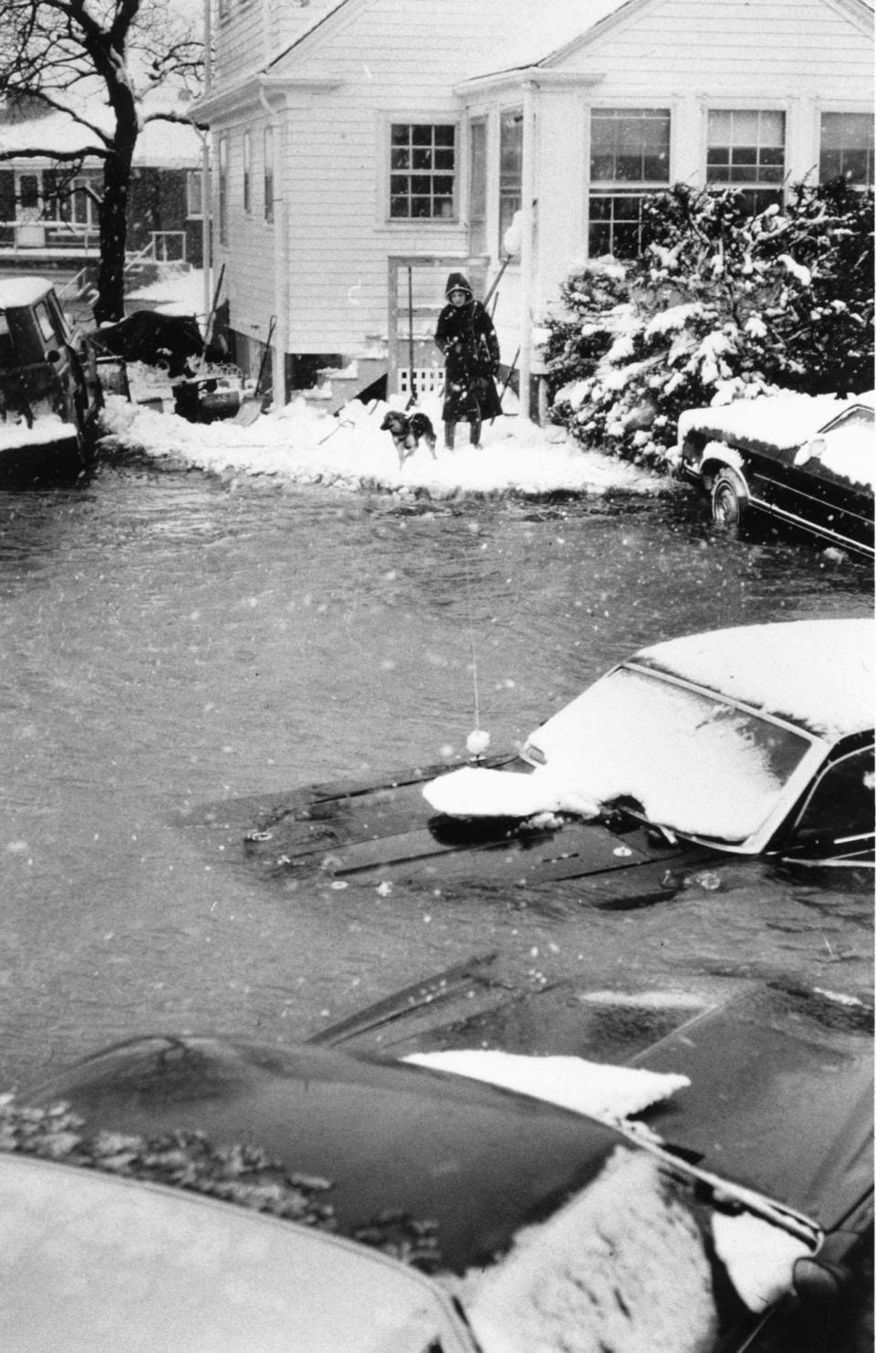 Snow wasn't the only hazard during the storm, evidenced by these swamped cars on Surf Road in Scituate, Mass.