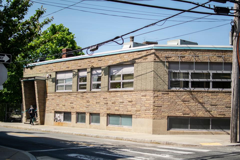 Crossroads Rhode Island is proposing to tear down this commercial building at 371 Pine St. and replace it with a five-story apartment building.