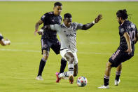 Montreal forward Romell Quioto, center, controls the ball as Inter Miami midfielder Gregore, left, and midfielder Rodolfo Pizarro (10) defend during the first half of an MLS soccer match Wednesday, May 12, 2021, in Fort Lauderdale, Fla. (AP Photo/Lynne Sladky)