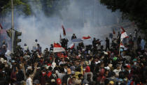 Smoke from tear gas fired by riot police when students in a clash in Jakarta, Indonesia, Monday, September 30, 2019. Thousands of Indonesian students continued to protest Monday against the new law which they said had paralyzed the body the country's anti-corruption, with several clashes with the police. (AP / Achmad Ibrahim photo)