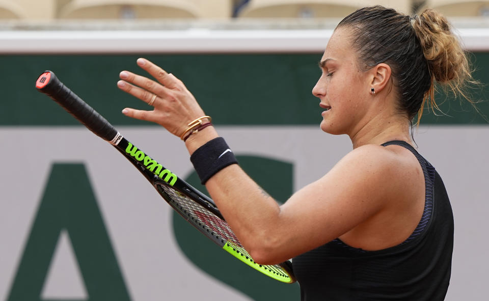 Belarus's Aryna Sabalenka reacts after losing a point against Russia's Anastasia Pavlyuchenkova during their third round match on day 6, of the French Open tennis tournament at Roland Garros in Paris, France, Friday, June 4, 2021. (AP Photo/Michel Euler)