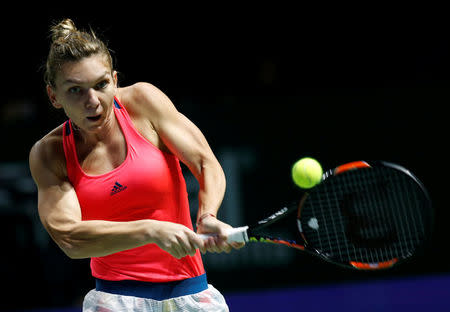 Tennis - Singapore WTA Finals Round Robin Singles - Singapore Indoor Stadium, Singapore - 25/10/2016 - Simona Halep of Romania in action against Angelique Kerber of Germany. REUTERS/Edgar Su