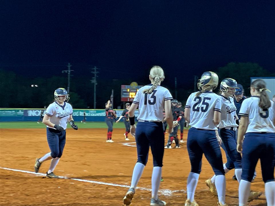 Gulf Breeze's Jacey Reed approaches home plate after hitting a home run during the team's 17-2 win over West Florida on Tuesday, April 4, 2023 from Gulf Breeze High School.