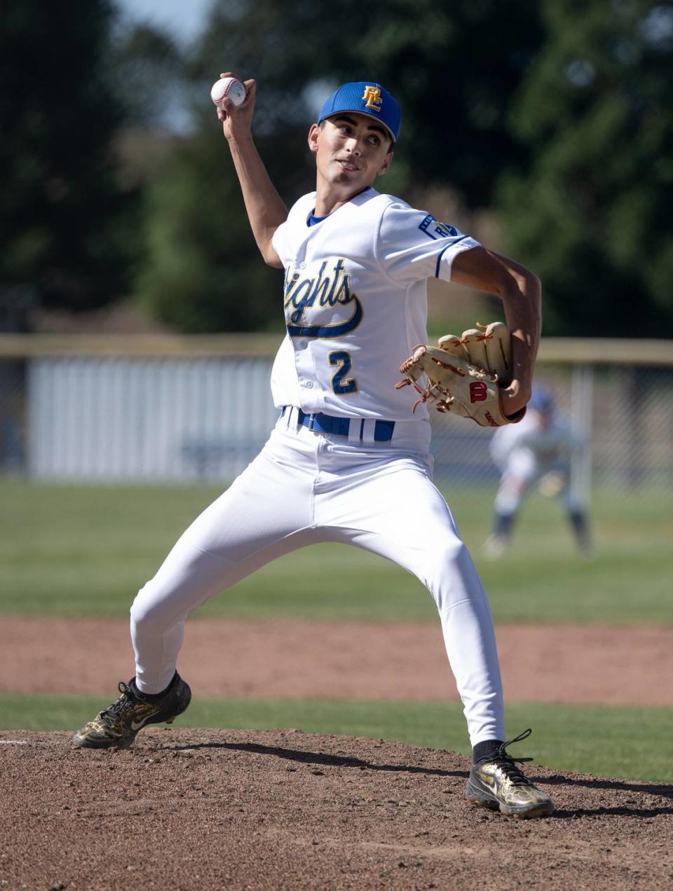 Ripon Christian’s Luke Crivello delivers a pitch during the Sac-Joaquin Section Division VI playoff game with Millennium of Tracy in Ripon, Calif., Wednesday, May 8, 2024. Crivello pitched a complete game, the Knights won 4-1.
