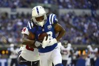 Sep 30, 2018; Indianapolis, IN, USA; Indianapolis Colts wide receiver T.Y. Hilton (13) makes a catch as Houston Texans defensive back Johnathan Joseph (24) defends during the second half at Lucas Oil Stadium. Mandatory Credit: Jeff Curry-USA TODAY Sports