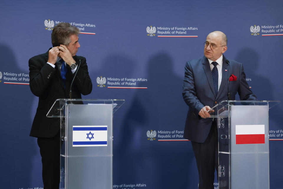 Poland's Minister of Foreign Affairs Zbigniew Rau, right, and his Israeli counterpart Eli Cohen, left, attend a joint press conference in Warsaw, Poland, Wednesday, March 22, 2023. (AP Photo/Michal Dyjuk)