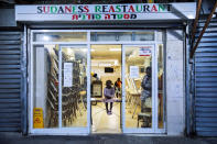 Sudanese migrant family seen in a closed sudanese restaurant in south Tel Aviv, Israel, Tuesday, Oct. 27, 2020. After Israel and Sudan agreed this month to normalize ties, some 6,000 Sudanese migrants in Israel are again fearing for their fate. Israel has long grappled with how to deal with its tens of thousands of African migrants. (AP Photo/Oded Balilty)