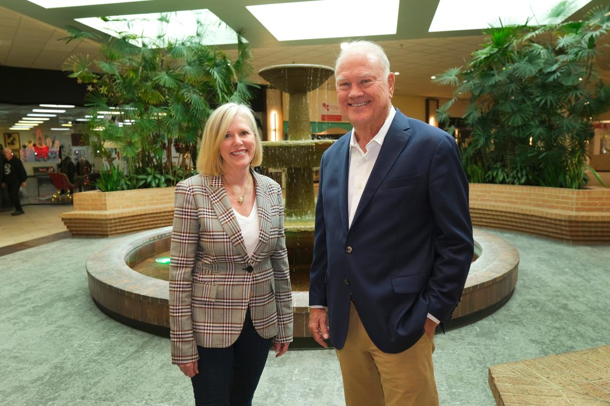 Kevyn Colburn, vice president, and Tom Morris, owner, stand by the original south fountain at Shoppes at Northpark.