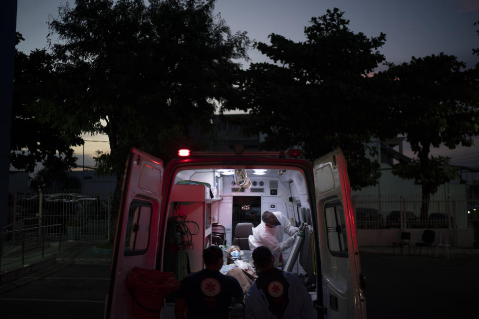 A COVID-19 patient arrives in an ambulance to the Sao Jose municipal hospital, in Duque de Caxias, Brazil, Wednesday, March 24, 2021. (AP Photo/Felipe Dana)