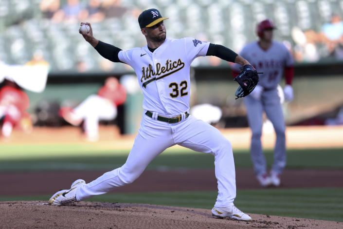 Oakland Athletics starting pitcher James Kaprielian (32) throws to a Los Angeles Angels batter during the first inning of a baseball game in Oakland, Calif., Tuesday, Aug.p 9, 2022. (AP Photo/Jed Jacobsohn)