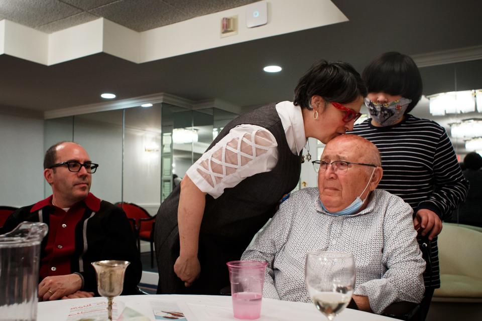 Missy Wolnerman kisses her father-in-law David Wolnerman as she leaves their family's  Seder dinner at the Park Fleur on Saturday, March 27, 2021, in Des Moines. It was one of the first kisses she had given him in over a year due to the COVID-19 pandemic.