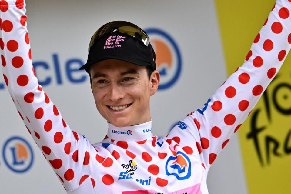EF Education  Easyposts US rider Neilson Powless celebrates on the podium with the best climbers dotted jersey after the 8th stage of the 110th edition of the Tour de France cycling race 201 km between Libourne and Limoges in central western France on July 8 2023 Photo by Marco BERTORELLO  AFP Photo by MARCO BERTORELLOAFP via Getty Images