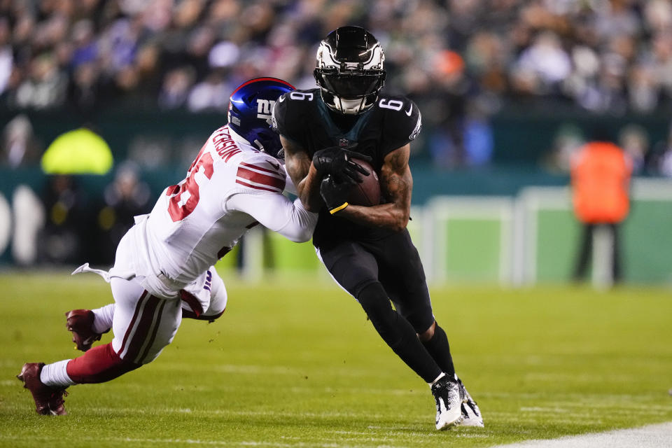 Philadelphia Eagles wide receiver DeVonta Smith (6) is tackled by New York Giants safety Tony Jefferson (36) after making ac a catch during the second half of an NFL football game, Sunday, Jan. 8, 2023, in Philadelphia. (AP Photo/Matt Slocum)