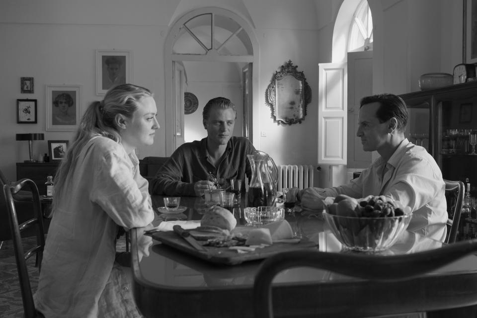 This image released by Netflix shows Dakota Fanning, from left, Johnny Flynn and Andrew Scott in a scene from "Ripley." (Netflix via AP)