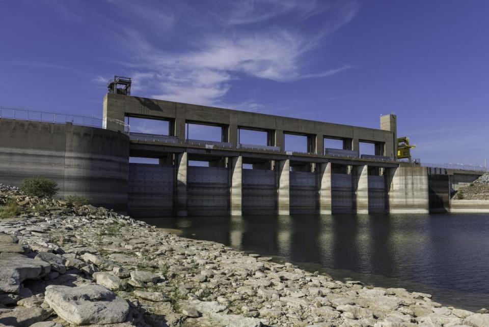 Water marks are seen on the dam gates and concrete at the Falcon Dam in Starr County on Aug. 18, 2022. This area of the reservoir is normally under water, but because of an extended drought, water levels have been below 20% full since earlier this year. The Falcon Dam was dedicated by U.S. President Dwight D. Eisenhower and Mexican President Adolfo Ruiz Cortines in 1953.