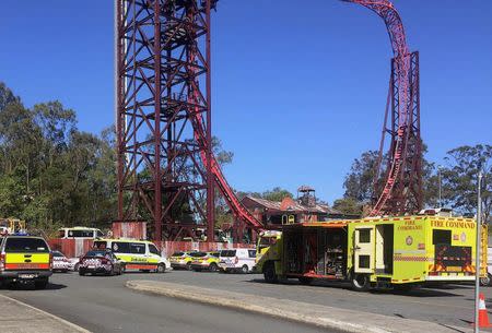 Emergency services vehicles can be seen outside the Dreamworld theme park at Coomera on the Gold Coast, Australia, October 25, 2016 after a number of people were reported killed on a ride at Australia's biggest theme park. AAP/Scott Bailey/via REUTERS