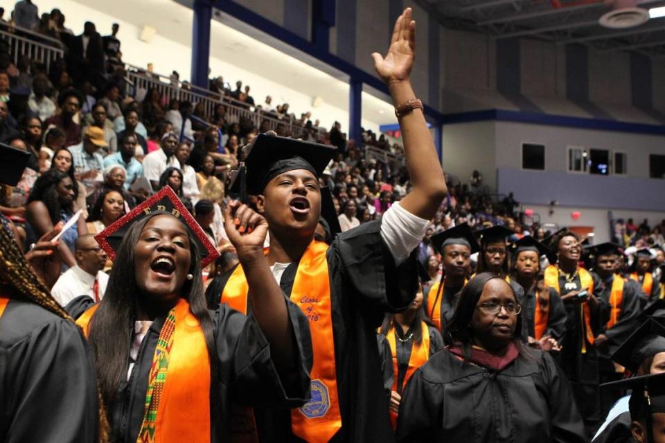 Miami Gardens is home to two universities: St. Thomas and Florida Memorial, where 2018 graduates included Vienisha Barr and Matthew Williamson in this file photo. Many commencements resume in-person in 2021, but with COVID-19 protocols.