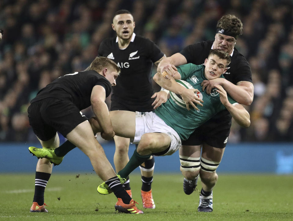 Ireland's Garry Ringrose is stopped in his tracks as he attacks during the rugby union international between Ireland and the New Zealand All Blacks in Dublin, Ireland, Saturday, Nov. 17, 2018. (AP Photo/Peter Morrison)