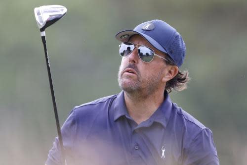 Phil Mickelson watches his tee shot on the 13th hole in the second round of the 122nd United States Open Championship