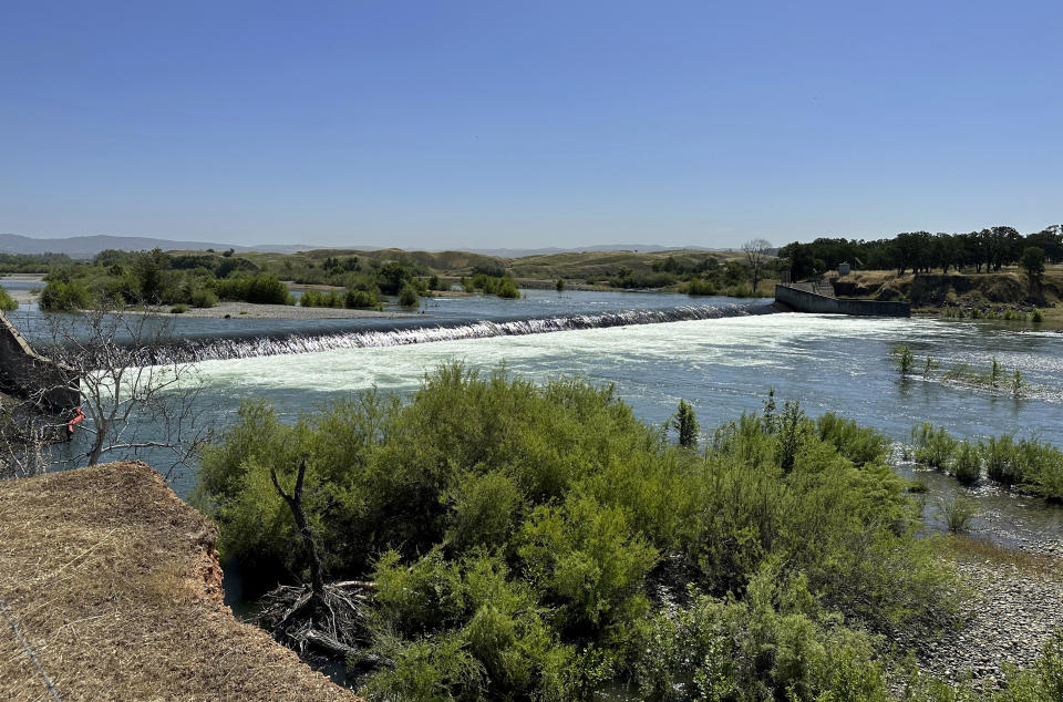 Daguerre Point Dam on Tuesday, May 16, 2023, in Marysville, Calif. State officials plan to build a channel around the dam so threatened species of fish can access more habitat. (AP Photo/Adam Beam)