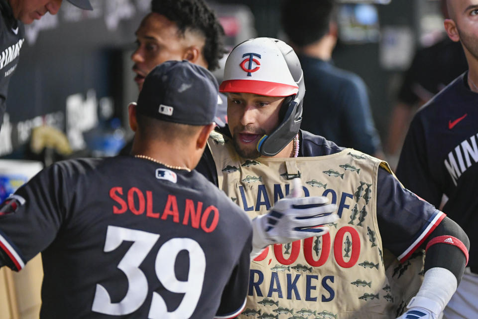 Minnesota Twins' Royce Lewis, right, celebrates with Donovan Solano after hitting a home run against the Cleveland Guardians during the fourth inning of a baseball game Tuesday, Aug. 29, 2023, in Minneapolis. (AP Photo/Craig Lassig)