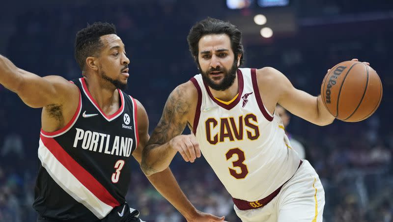 Cleveland Cavaliers guard Ricky Rubio, right, drives against then-Portland Trail Blazers guard CJ McCollum during an NBA basketball game on Nov. 3, 2021, in Cleveland.