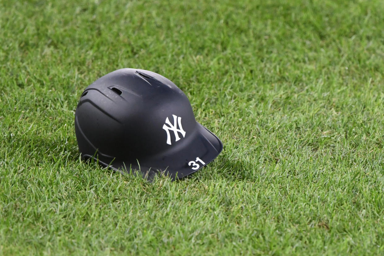 BALTIMORE, MD - SEPTEMBER 05:  Aaron Hicks #31 of the New York Yankees batting helmet on the grass during a game baseball game against the Baltimore Orioles at Oriole Park at Camden Yards on September 5, 2020 in Baltimore, Maryland.  (Photo by Mitchell Layton/Getty Images)