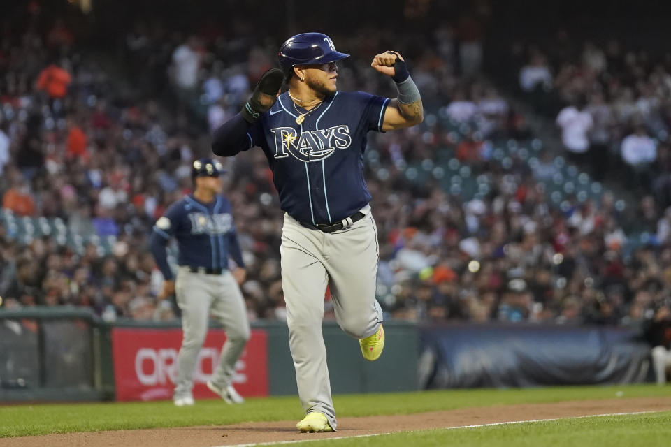 Tampa Bay Rays' Harold Ramirez gestures while running home to score on an RBI single by Christian Bethancourt during the fifth inning of a baseball game against the San Francisco Giants in San Francisco, Monday, Aug. 14, 2023. (AP Photo/Jeff Chiu)