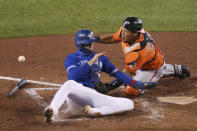 Toronto Blue Jays' Cavan Biggio beats Baltimore Orioles catcher Pedro Severino to the plate on a ball hit by Vladimir Guerrero Jr. during the eighth inning of a baseball game Saturday, Sept. 26, 2020, in Buffalo, N.Y. (AP Photo/Jeffrey T. Barnes)