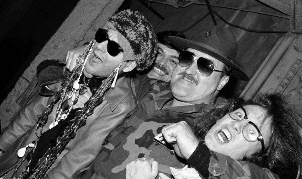 A vintage photograph of Michael Musto, Randy Jones of the Village People, professional wrestler Sgt. Slaughter and James St. James in a nightclub.