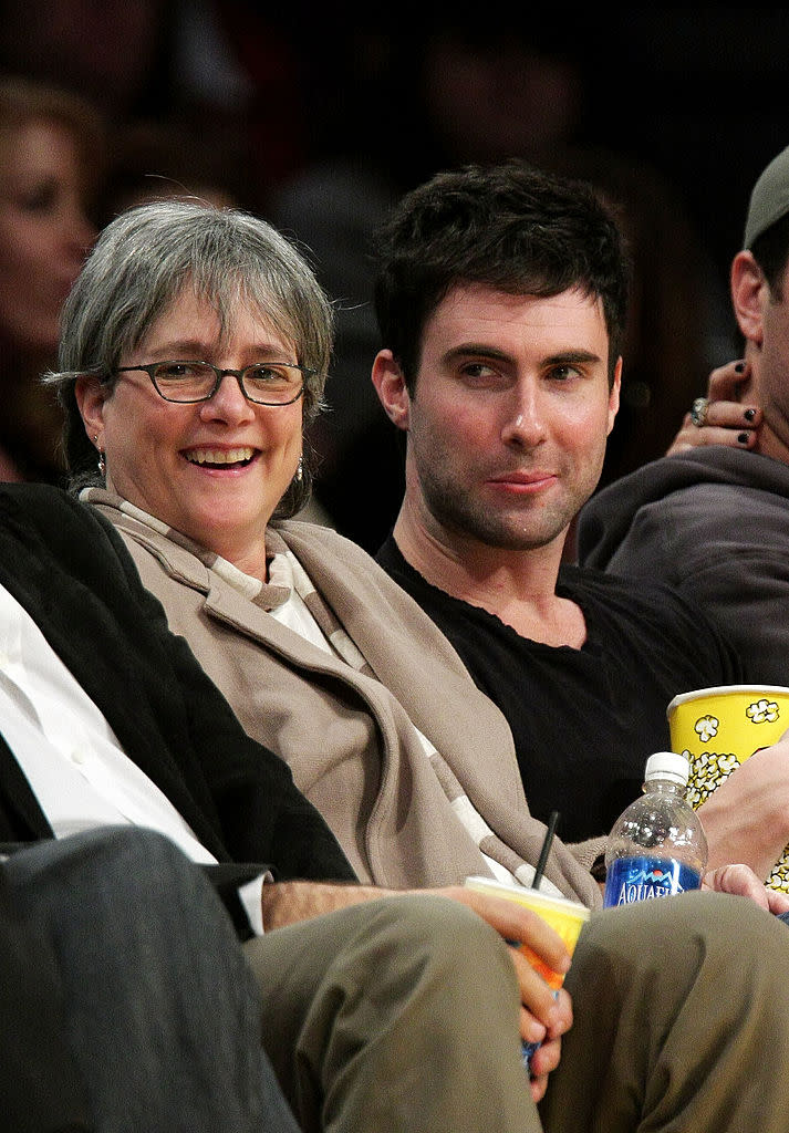 <p>Adam Levine (R) and his mother Patsy Noah (L) attend the Los Angeles Lakers vs Oklahoma City Thunder game at the Staples Center on February 10, 2009 in Los Angeles, California. </p>