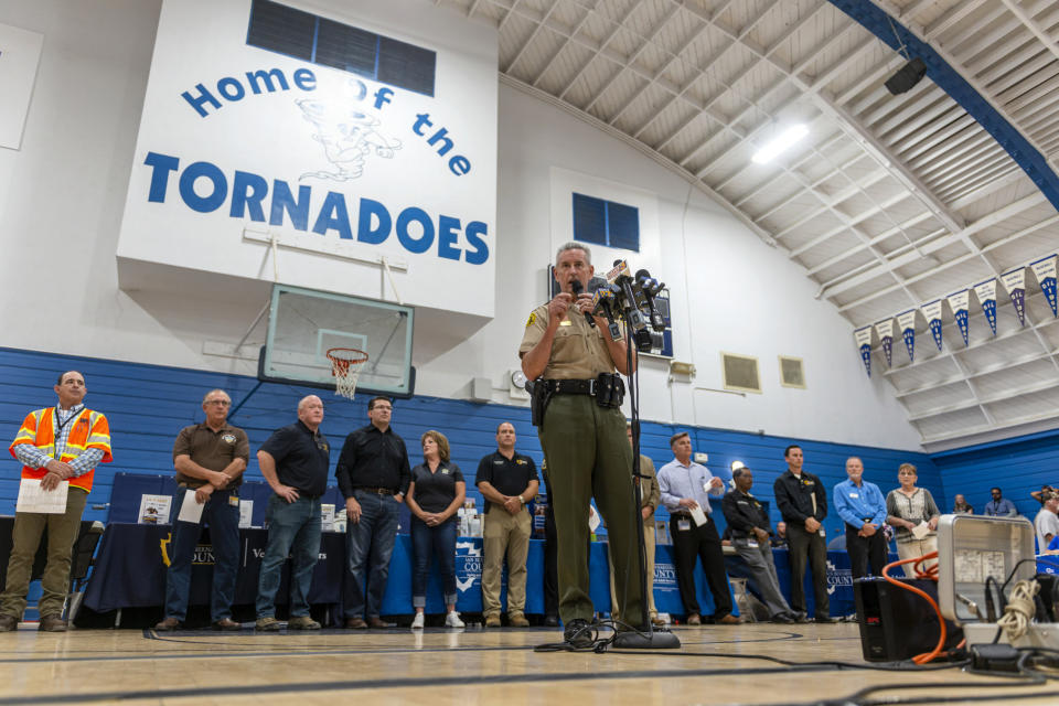 San Bernardino County Sheriff John McMahon speaks to residents and others during a town hall meeting in Trona, Calif., on Wednesday, July 10, 2019. San Bernardino County officials offered updates from several county, state governments and utilities. Aftershocks of last week's big earthquakes are still rumbling beneath the California desert, but seismologists say the probability of large quakes continues to decline. (James Quigg/The Daily Press via AP)
