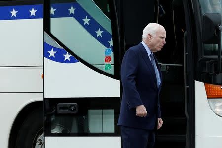 U.S. Senator John McCain (R-AZ) boards a Senate caravan bus from Capitol Hill to attend a North Korea briefing at the White House, in Washington, U.S., April 26, 2017. REUTERS/Yuri Gripas